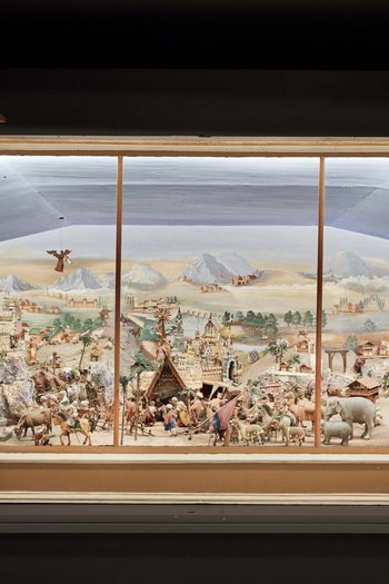 Art in the design hotel in South Tyrol Large nativity scene with figures and landscape behind glass display
