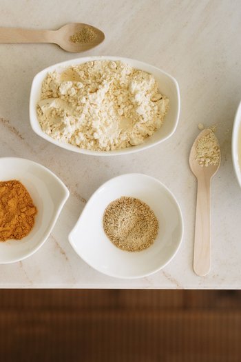 Wellness hotel in South Tyrol | Dolomites Various spices and flour in white bowls on a marble table
